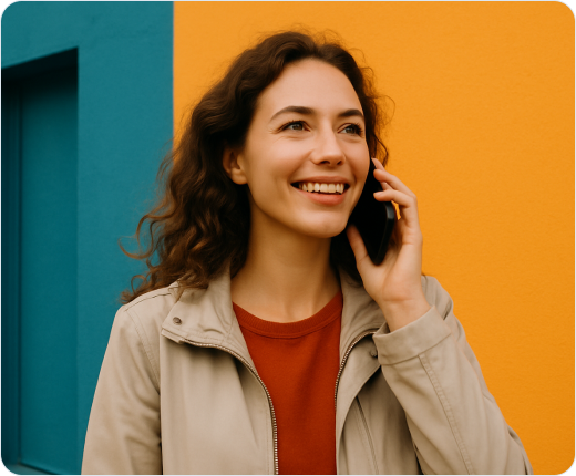 Smiling woman talking on mobile phone