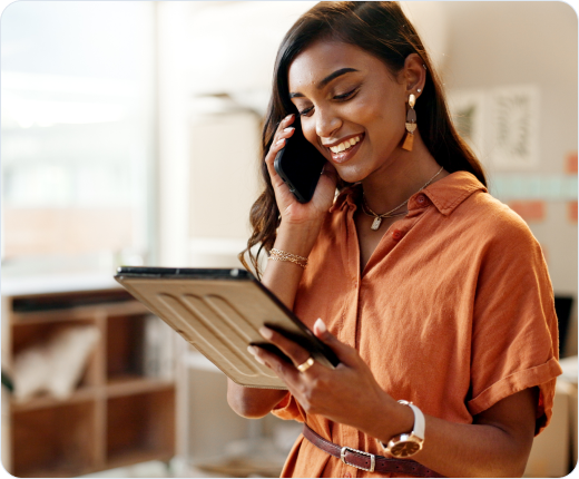 Smiling woman talking on mobile phone